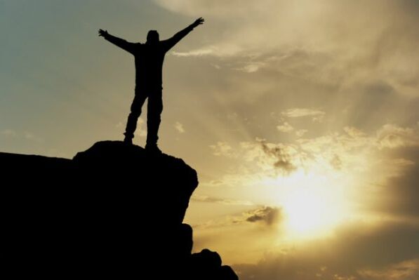 Man on top of a mountain
