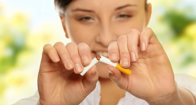 the girl smokes a cigarette and gets rid of the addiction
