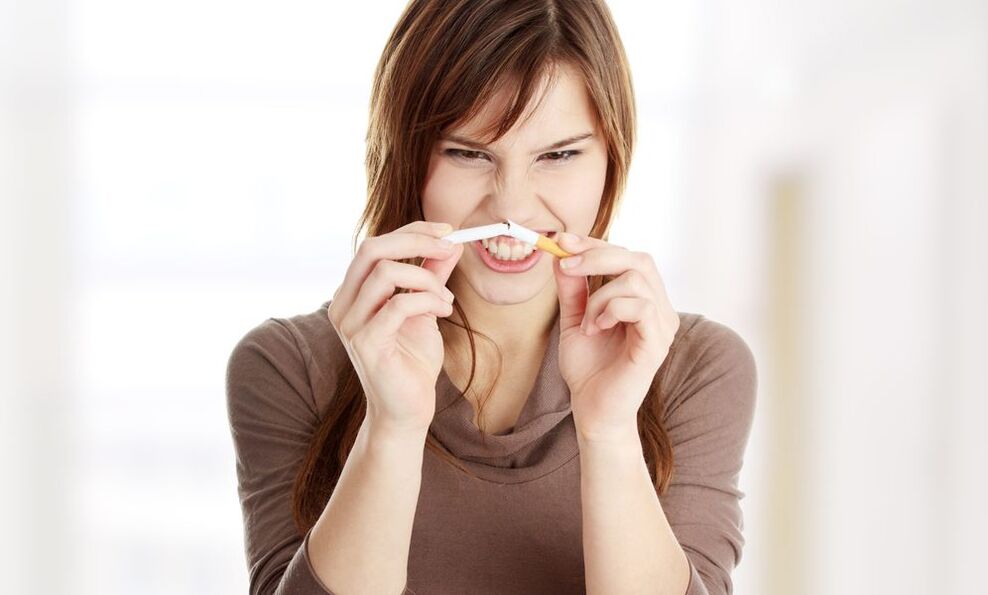 girl breaks a cigarette and quits smoking Figure 1